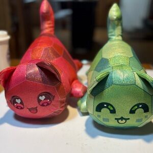 Aphmau MeeMeows collectible plush toys, specifically the Ruby Cat Emerald Cat 11